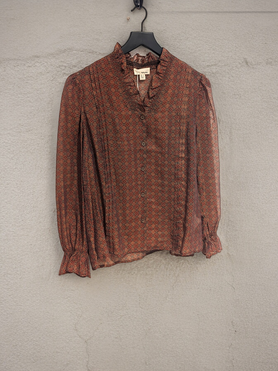 RUFFLE NECK LONG SLEEVE THE KORNER